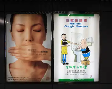 img_8022 "Don't be blind to corruption" and "maintain cough manners" posters in the Hong Kong metro system.