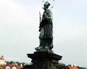 dscf0013 Statue on Charles bridge. Martyrdom of St John Nepomuk, 1683. People touch parts of the base for luck.