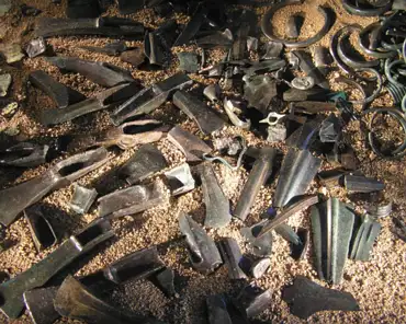 114 The hoard of Malassis in Chéry, middle bronze age (1500-1000 BC). A large vase containing 12 kg of bronze tools, some broken and some in good condition,...