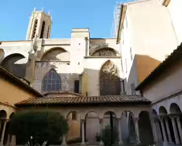 P1150597 Romanesque cloister, 12th century. Almost all columns and capitals are original, except for a few marble columns reused from former Roman constructions on the...