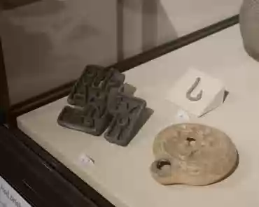 P1070412 Ancient city of Dura-Europos, rediscovered in the early 20th century. Bread stamp in the shape of a swastika with a Greek inscription, bronze, 165-256 AD.