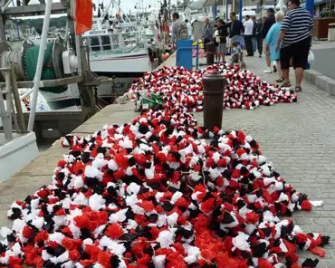 P1110157 Paper flowers are deployed in the harbor once every 5 years to commemorate sailors lost at sea.