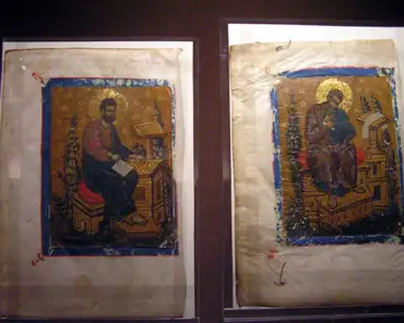 pc070063 Illuminations on paper with representation of St John (left) and St Mark (right), pasted onto a leaf on a parchment manuscript Book of Gospels, 14-15th century.