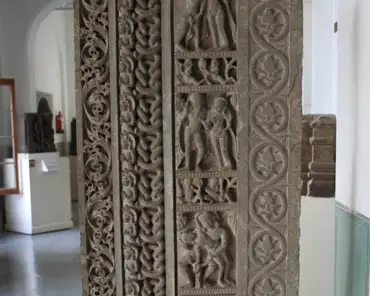 IMG_3692 Right temple door jamb, 10-11th century. Stone temple door jamb with three columns containing patterns of flowers, serpent deities and panels of Gandharvas,...